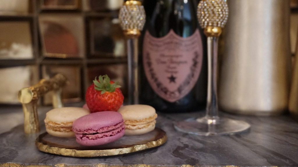 French Macaroons With Dom Perignon Champagne In Background