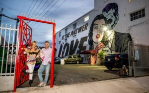 boyd Tasker with wife christi Tasker at wynwood lab, casa wynwood miami in front of d face mural in wynwood arts district miami florida
